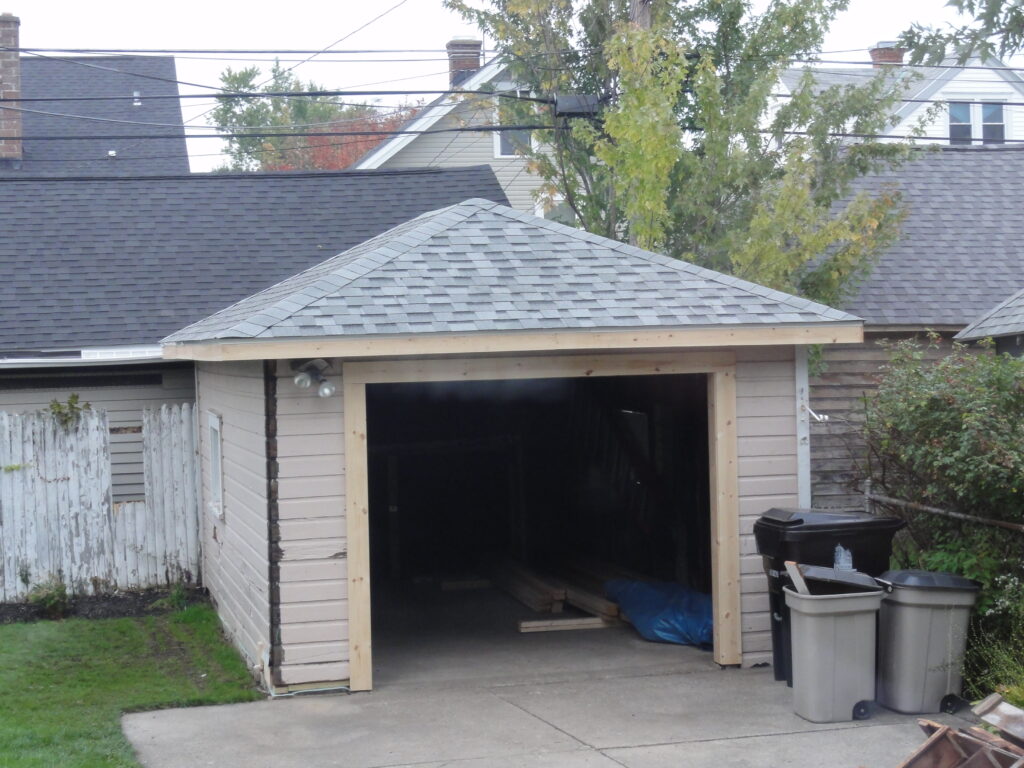 Garage roof installed and door trim rebuilt